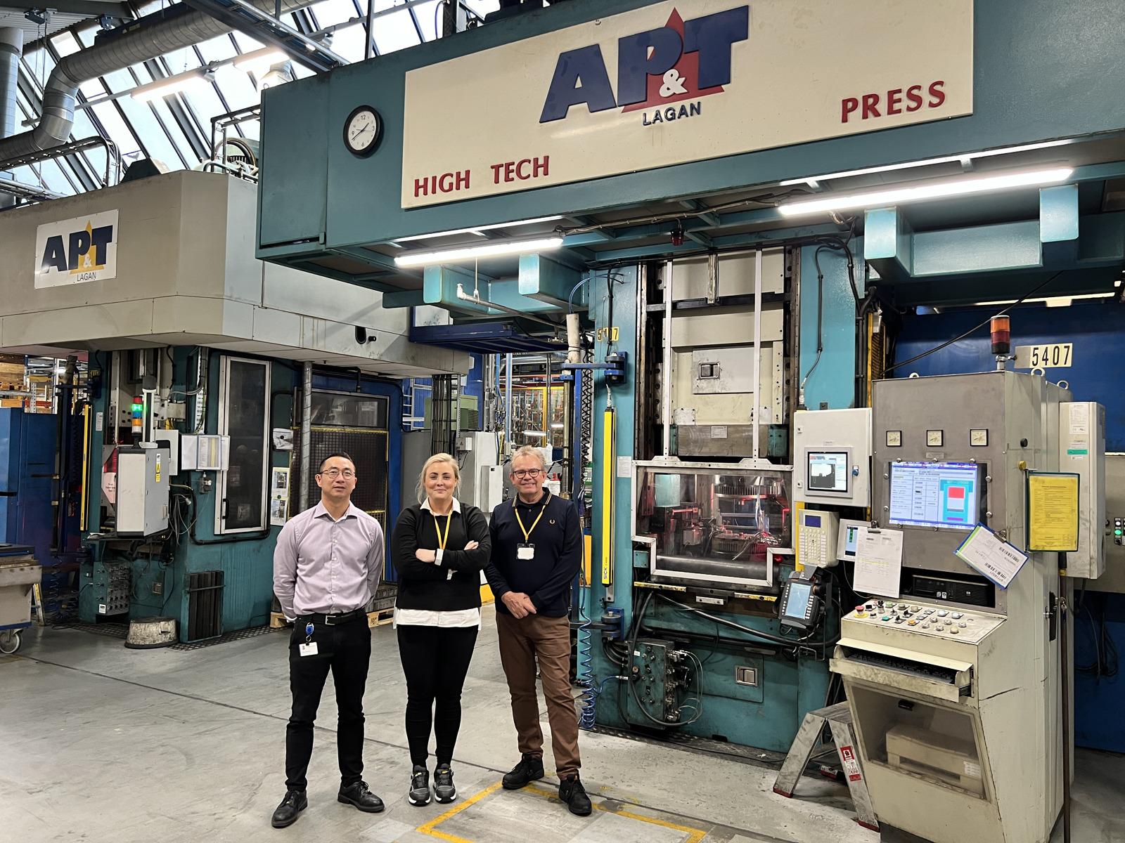 High-tech, then and now. Grundfos in Bjerringbro, Denmark has ordered a new energy-efficient servo hydraulic press from AP&T for installation in 2025. Here, Peter Lund Pedersen, project manager at Grundfos with Sandra Johansson, project manager at AP&T and Peter Karlsson, Key Account and Area Sales Manager, also at AP&T, standing in front of one of the older AP&T presses in the facility.  